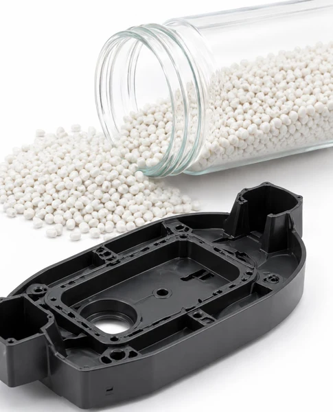Plastic part with resin pellets